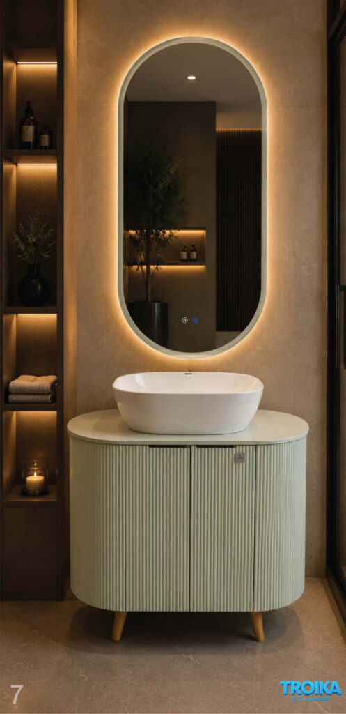 Freestanding rounded vanity on wooden legs with vessel basin and full-height backlit pill-shaped mirror